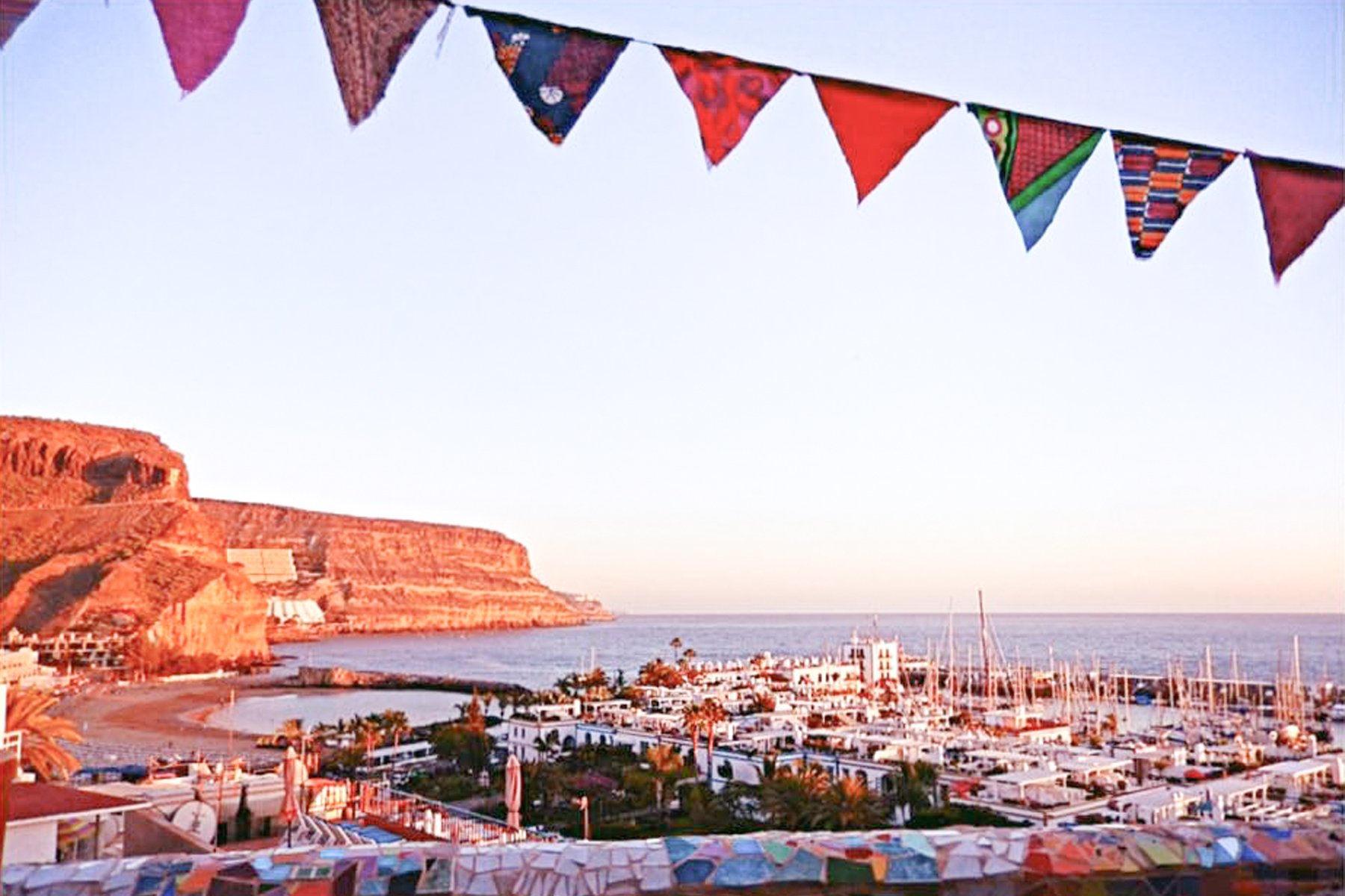 Image of a scenery of the sea and houses from a terrace