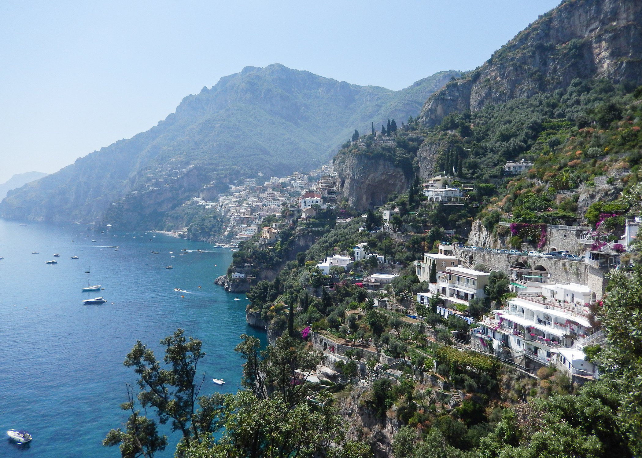 Image of houses situated in the mountains next to the sea