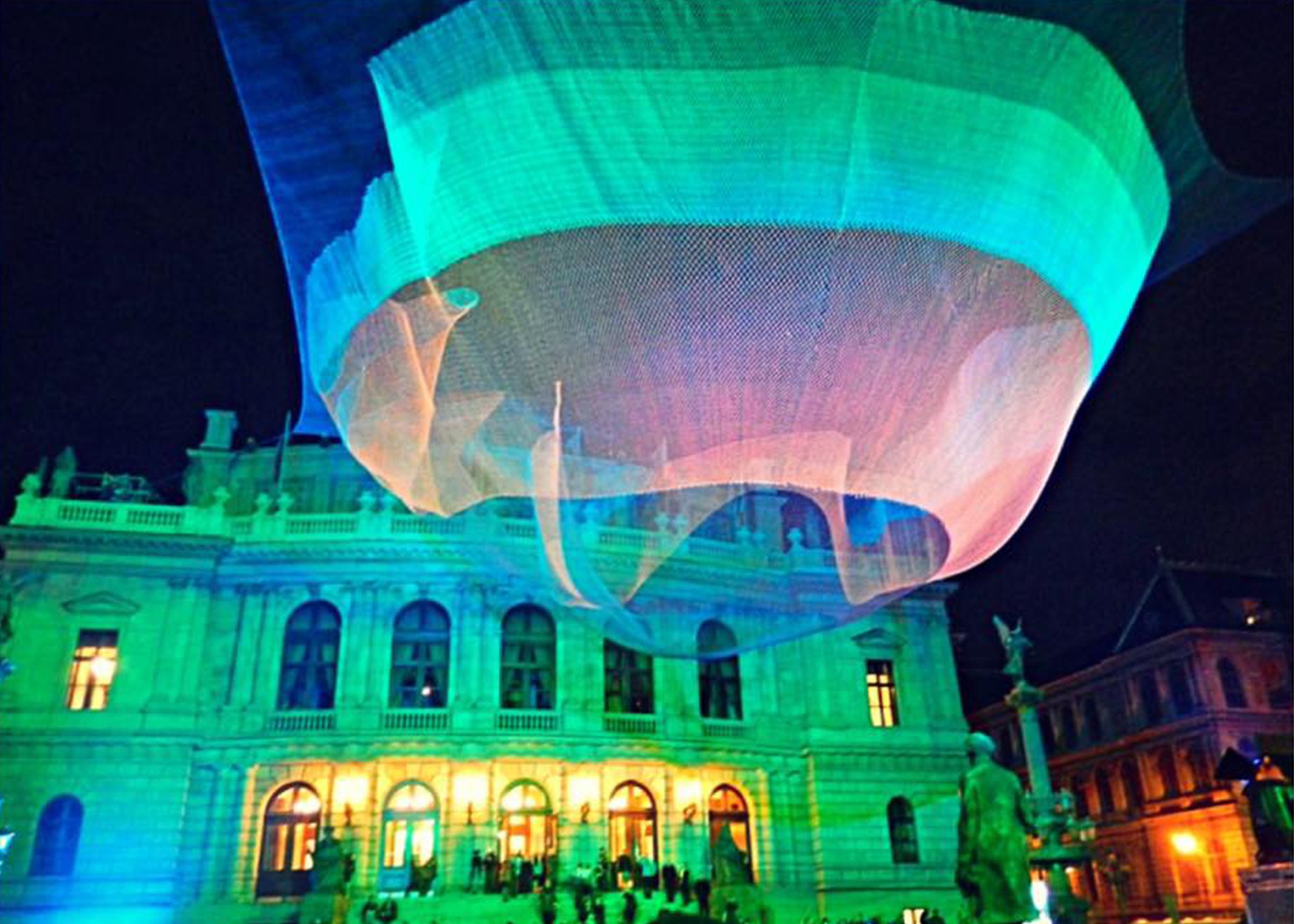 Image of a light show in front of a building